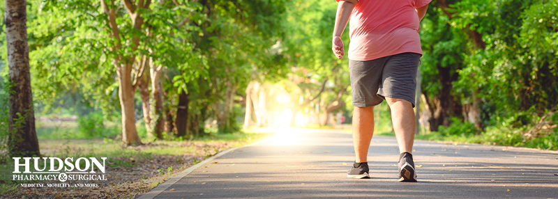 Man walking on a path outdoors with diabetic shoes on