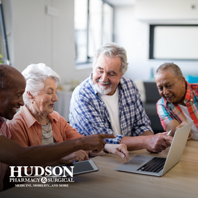 Family of older individuals looking over a checklist at the table together